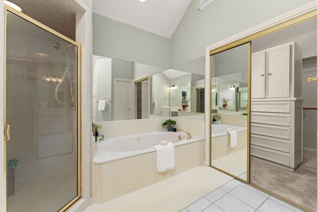 4206 River Place Blvd, Austin, TX 78730 - bathroom featuring a bath, a stall shower, lofted ceiling, and tile patterned floors