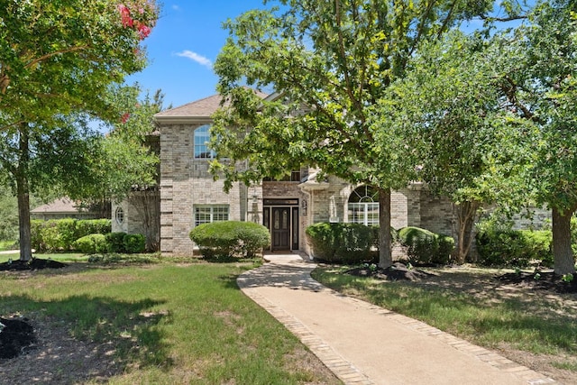 4206 River Place Blvd, Austin, TX 78730 - obstructed view of property with brick siding and a front lawn