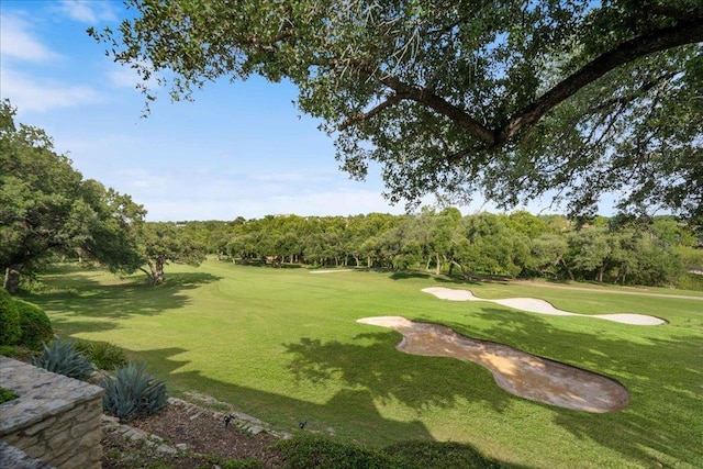 110 W Eagle Dr, The Hills, TX 78738 - surrounding community featuring view of golf course, a lawn, and view of wooded area