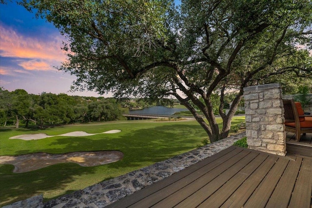 110 W Eagle Dr, The Hills, TX 78738 - deck at dusk with golf course view, a water view, and a yard