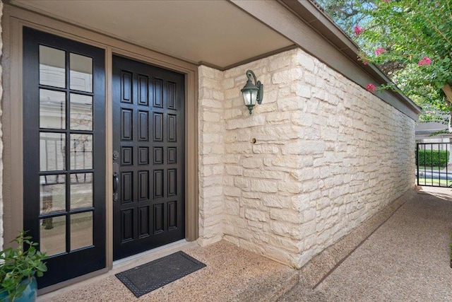 110 W Eagle Dr, The Hills, TX 78738 - doorway to property featuring stone siding