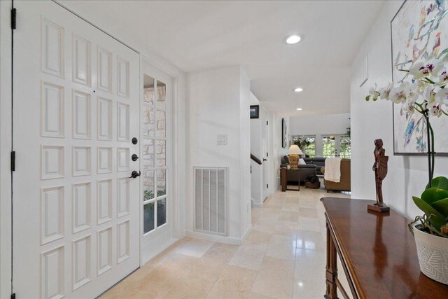 110 W Eagle Dr, The Hills, TX 78738 - foyer with recessed lighting, stairs, and light tile patterned flooring
