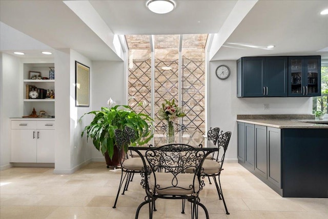110 W Eagle Dr, The Hills, TX 78738 - dining area featuring built in features, recessed lighting, and light tile patterned flooring
