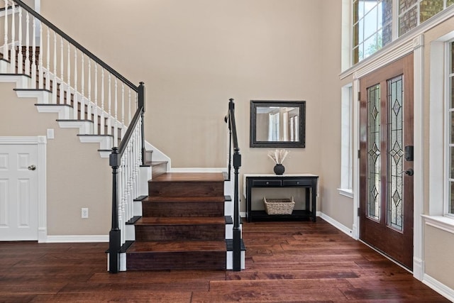 2743 Grimes Ranch Rd, Austin, TX 78732 - foyer entrance featuring stairway, wood finished floors, and a towering ceiling