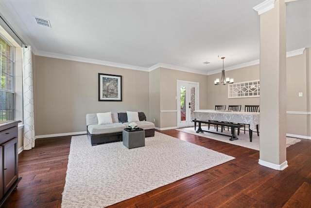 2743 Grimes Ranch Rd, Austin, TX 78732 - living room featuring dark wood finished floors, a chandelier, and crown molding