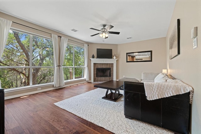 2743 Grimes Ranch Rd, Austin, TX 78732 - living area featuring ceiling fan, wood finished floors, and a fireplace
