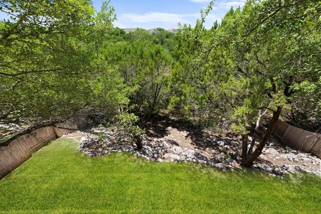 2743 Grimes Ranch Rd, Austin, TX 78732 - view of yard with a wooded view