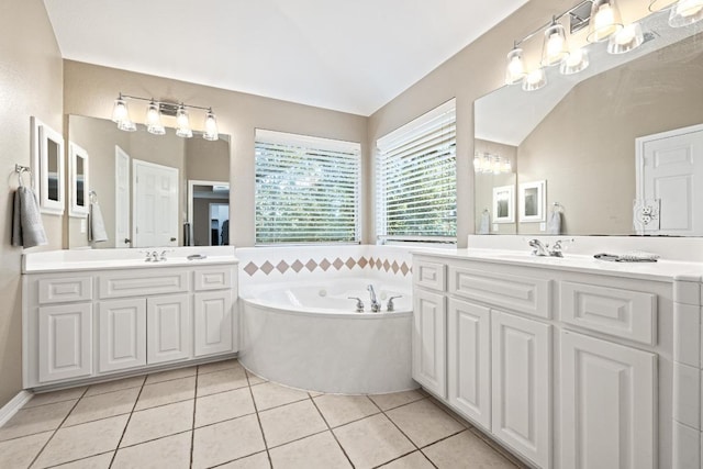 2743 Grimes Ranch Rd, Austin, TX 78732 - bathroom featuring two vanities, a bath, and tile patterned flooring