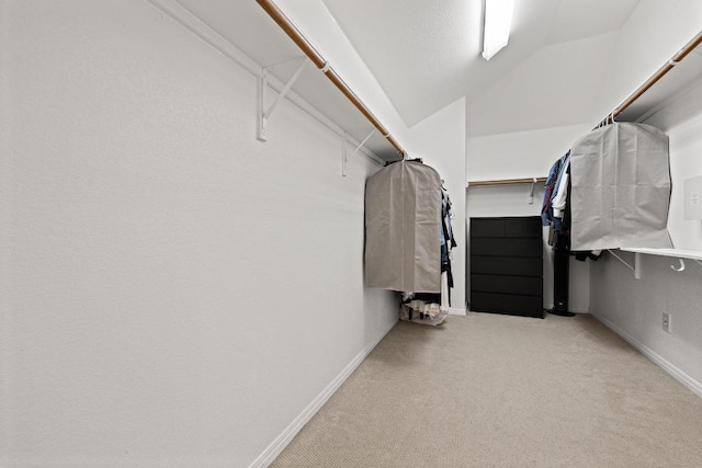 2743 Grimes Ranch Rd, Austin, TX 78732 - spacious closet featuring carpet flooring and vaulted ceiling