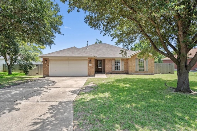 1503 Sherry Dr, Taylor, TX 76574 - ranch-style home with a garage, concrete driveway, and brick siding