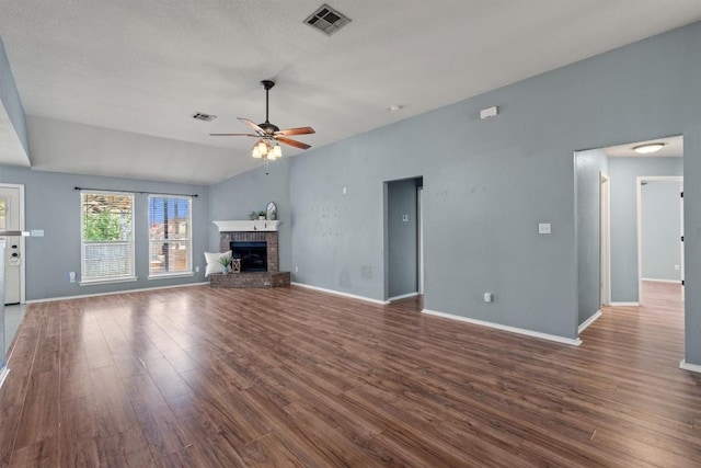 1503 Sherry Dr, Taylor, TX 76574 - unfurnished living room featuring ceiling fan, wood finished floors, and a fireplace