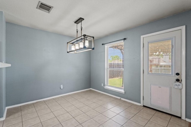 1503 Sherry Dr, Taylor, TX 76574 - unfurnished dining area featuring light tile patterned flooring and baseboards