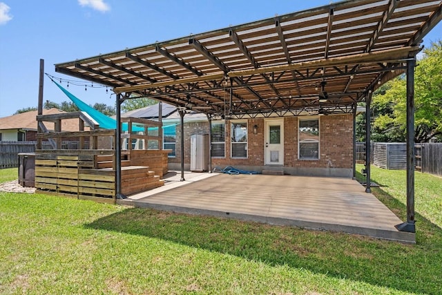 1503 Sherry Dr, Taylor, TX 76574 - view of patio with a wooden deck, a ceiling fan, and a carport