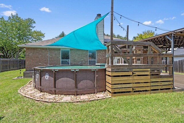 1503 Sherry Dr, Taylor, TX 76574 - back of property with brick siding and a chimney
