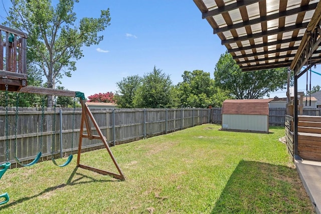 1503 Sherry Dr, Taylor, TX 76574 - fenced backyard with a storage unit