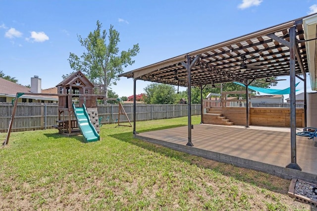 1503 Sherry Dr, Taylor, TX 76574 - fenced backyard featuring a playground and a patio area
