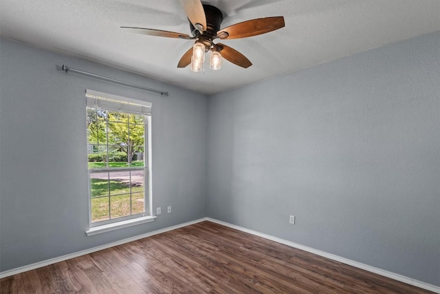 1503 Sherry Dr, Taylor, TX 76574 - spare room with dark wood-style flooring and a ceiling fan