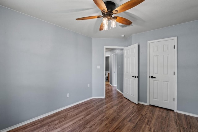 1503 Sherry Dr, Taylor, TX 76574 - unfurnished bedroom featuring dark wood-type flooring and a ceiling fan