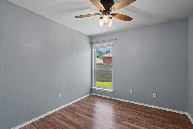 1503 Sherry Dr, Taylor, TX 76574 - unfurnished room featuring dark wood finished floors and a ceiling fan