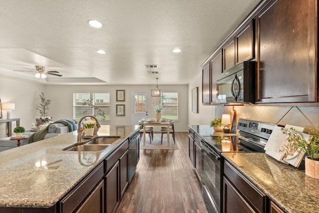 1305 Cozy Creek Dr, Temple, TX 76502 - kitchen with electric range, black microwave, dark wood-style flooring, recessed lighting, and dishwasher