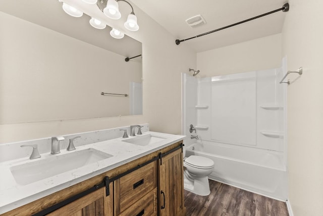 1305 Cozy Creek Dr, Temple, TX 76502 - full bathroom featuring shower / tub combination, double vanity, and wood finished floors