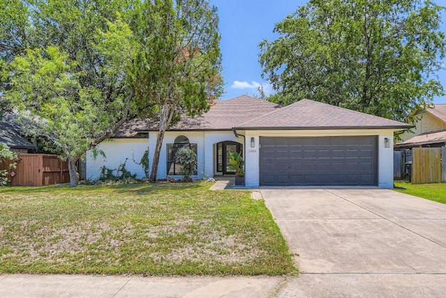 11325 Stormy Ridge Rd, Austin, TX 78739 - ranch-style house with driveway, an attached garage, and brick siding