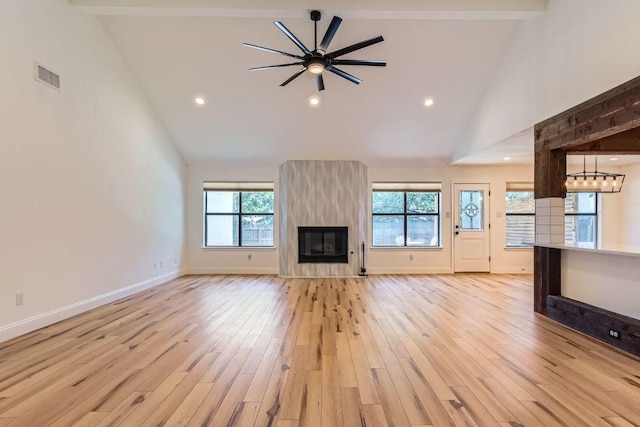 11325 Stormy Ridge Rd, Austin, TX 78739 - unfurnished living room with high vaulted ceiling, light wood-style flooring, a large fireplace, recessed lighting, and a ceiling fan