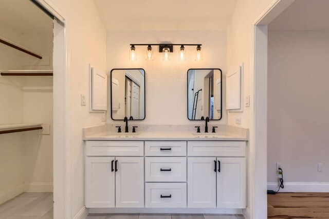 11325 Stormy Ridge Rd, Austin, TX 78739 - bathroom with double vanity and a spacious closet