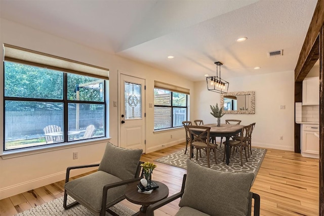 11325 Stormy Ridge Rd, Austin, TX 78739 - living area featuring light wood-type flooring, recessed lighting, and a chandelier