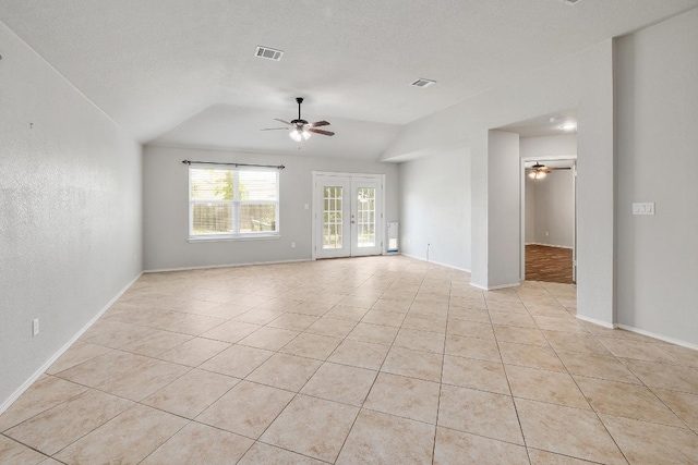 17729 Cahir Glen Cv, Pflugerville, TX 78660 - unfurnished room with a ceiling fan, vaulted ceiling, and light tile patterned floors