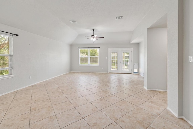 17729 Cahir Glen Cv, Pflugerville, TX 78660 - unfurnished room with a ceiling fan, light tile patterned floors, vaulted ceiling, and french doors