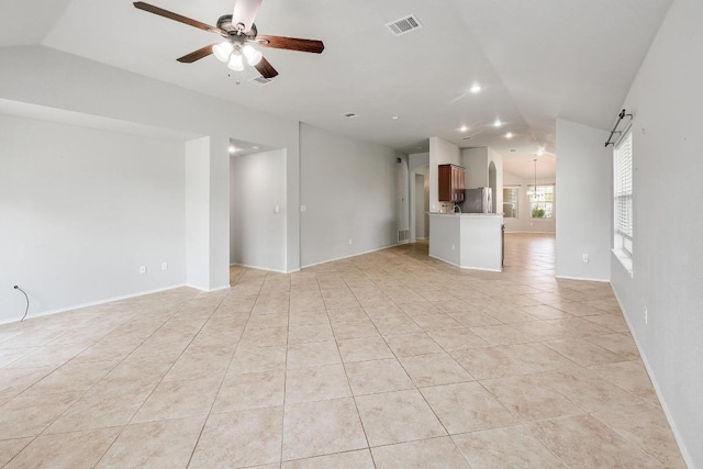17729 Cahir Glen Cv, Pflugerville, TX 78660 - unfurnished living room featuring vaulted ceiling, ceiling fan, light tile patterned floors, and recessed lighting