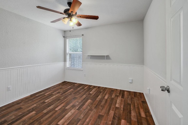 17729 Cahir Glen Cv, Pflugerville, TX 78660 - spare room with wood finished floors, wainscoting, and ceiling fan