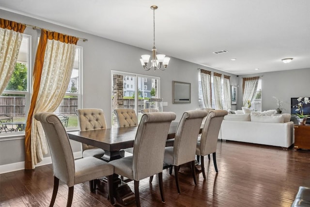 7016 Lickeen Ct, Austin, TX 78744 - dining space with a chandelier, dark wood finished floors, and recessed lighting