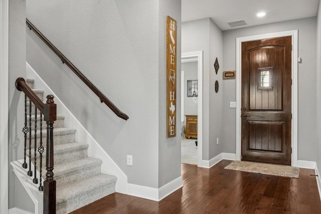 7016 Lickeen Ct, Austin, TX 78744 - foyer featuring dark wood finished floors, stairs, and recessed lighting