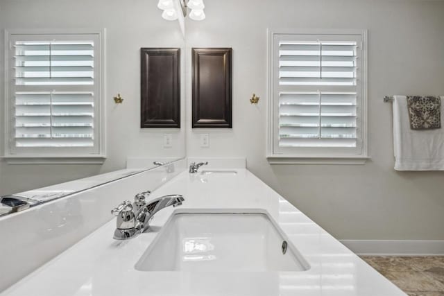 7016 Lickeen Ct, Austin, TX 78744 - full bath featuring double vanity and baseboards