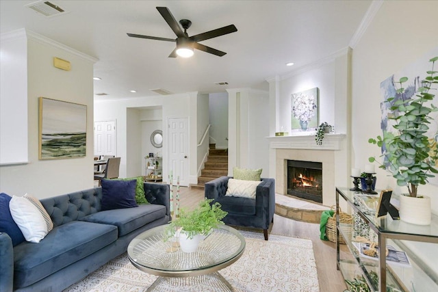 1303UNIT13A N Cuernavaca Dr Unit A13, Austin, TX 78733 - living area featuring light wood-style flooring, stairs, a warm lit fireplace, crown molding, and ceiling fan