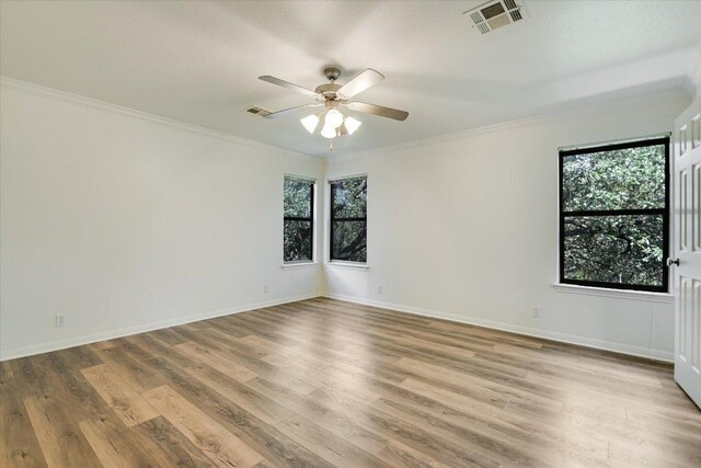 1303UNIT13A N Cuernavaca Dr Unit A13, Austin, TX 78733 - spare room with plenty of natural light, a ceiling fan, wood finished floors, and crown molding
