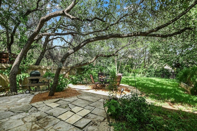 1303UNIT13A N Cuernavaca Dr Unit A13, Austin, TX 78733 - fenced backyard featuring a patio area and grilling area