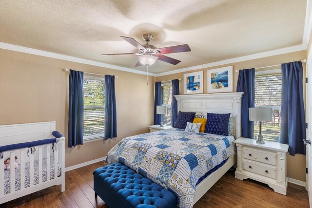 110 Lost River Rd, Georgetown, TX 78628 - bedroom featuring multiple windows, dark wood finished floors, ornamental molding, ceiling fan, and a textured ceiling