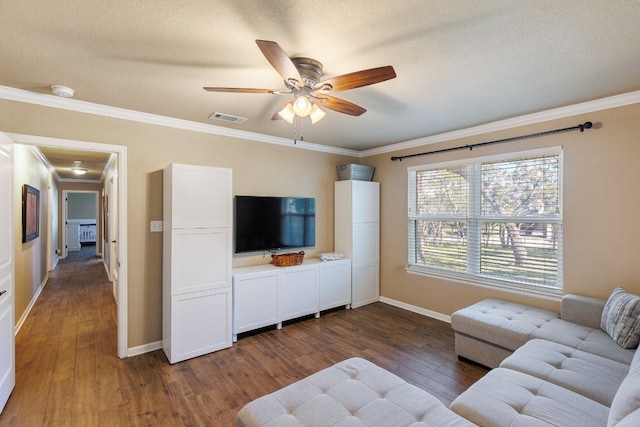 110 Lost River Rd, Georgetown, TX 78628 - living room with dark wood-style flooring, ornamental molding, and ceiling fan