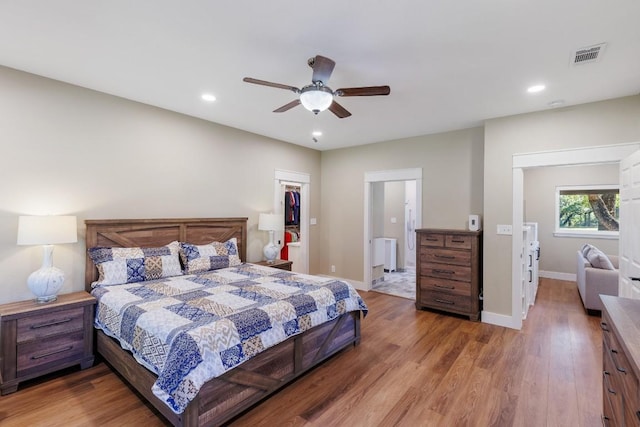 110 Lost River Rd, Georgetown, TX 78628 - bedroom with wood finished floors, recessed lighting, a walk in closet, ceiling fan, and a closet