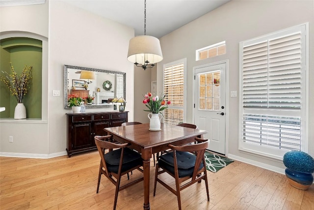10628 Indigo Broom Loop, Austin, TX 78733 - dining space featuring light wood-style floors and a towering ceiling