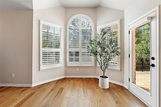 10628 Indigo Broom Loop, Austin, TX 78733 - interior space featuring light wood finished floors and vaulted ceiling