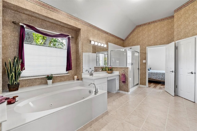 10628 Indigo Broom Loop, Austin, TX 78733 - bathroom featuring vaulted ceiling, a stall shower, a jetted tub, tile patterned floors, and vanity