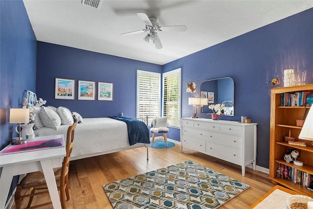 10628 Indigo Broom Loop, Austin, TX 78733 - bedroom with light wood-style floors and a ceiling fan