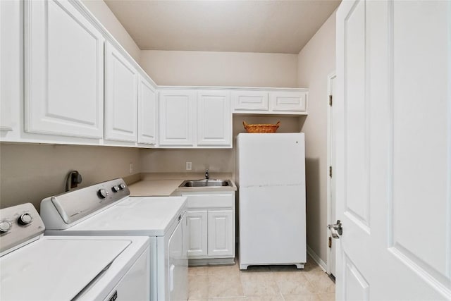 10628 Indigo Broom Loop, Austin, TX 78733 - washroom with independent washer and dryer, cabinet space, and light tile patterned flooring