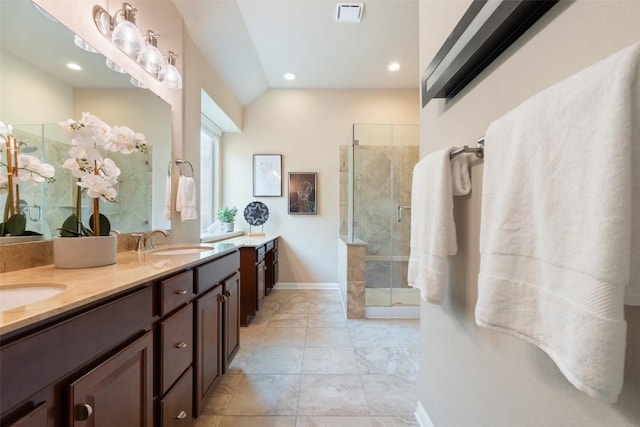 18517 Tanner Bayou Loop, Austin, TX 78738 - bathroom with a shower stall, double vanity, recessed lighting, and lofted ceiling