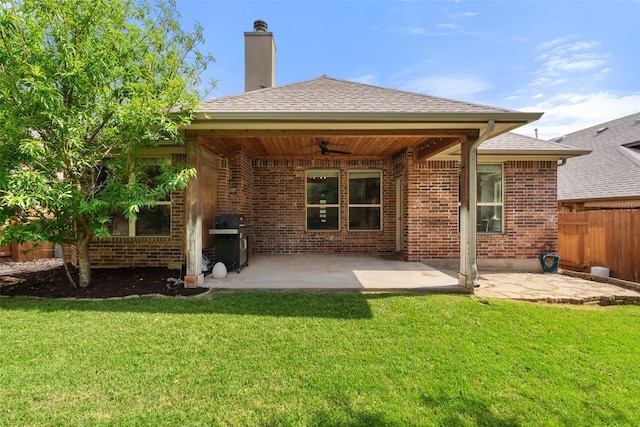 18517 Tanner Bayou Loop, Austin, TX 78738 - rear view of house with ceiling fan, brick siding, a patio, and a chimney