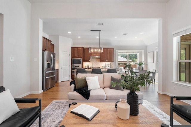 18517 Tanner Bayou Loop, Austin, TX 78738 - living area featuring light wood-type flooring and recessed lighting
